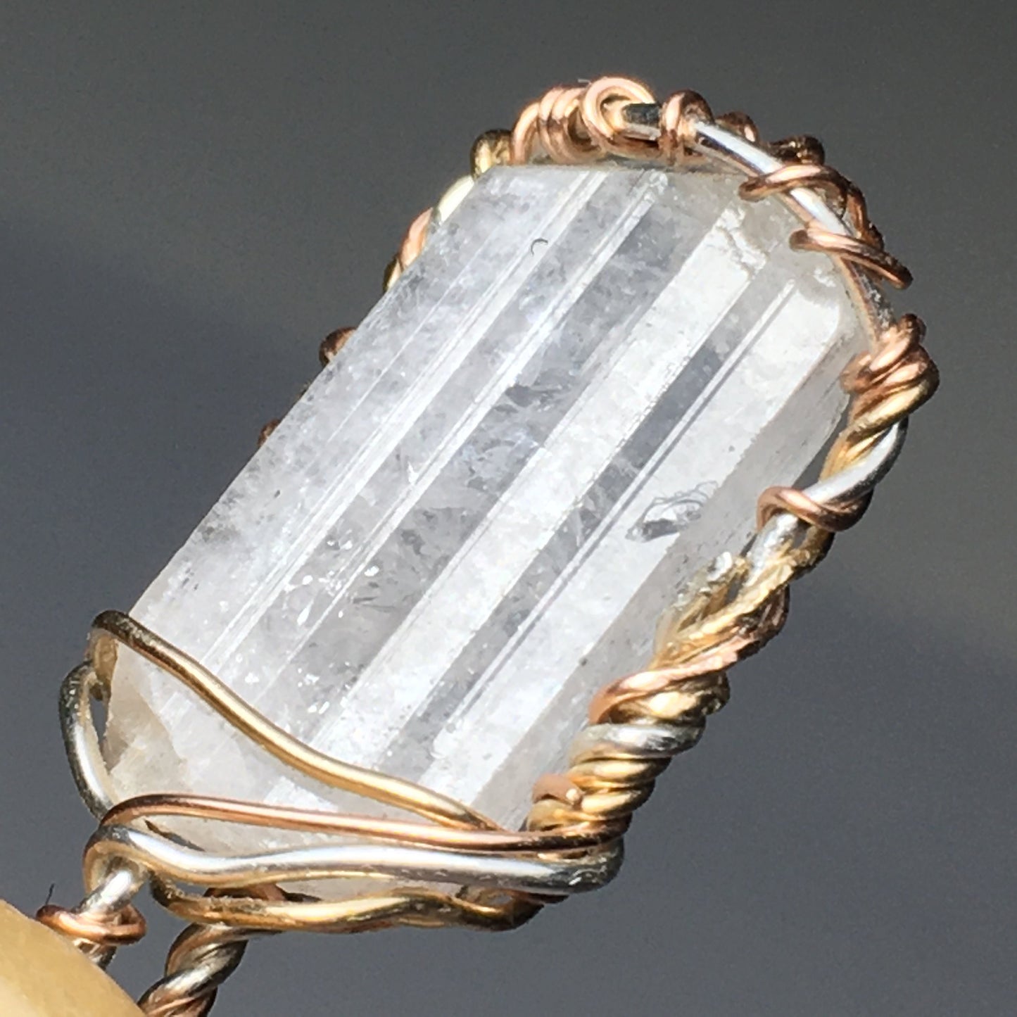 Danburite Crystal on Silver and Gold Pendant